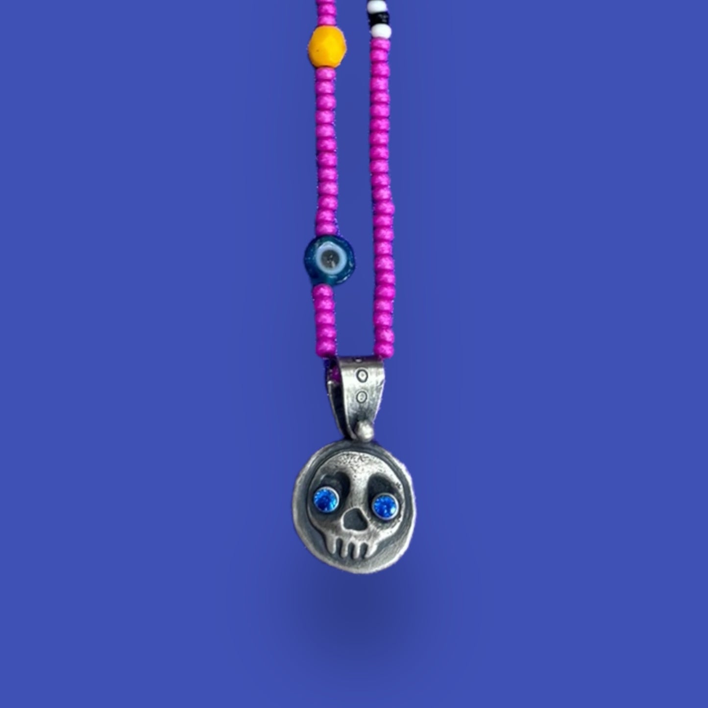 Little Skullie with Blue Spinel Eyes