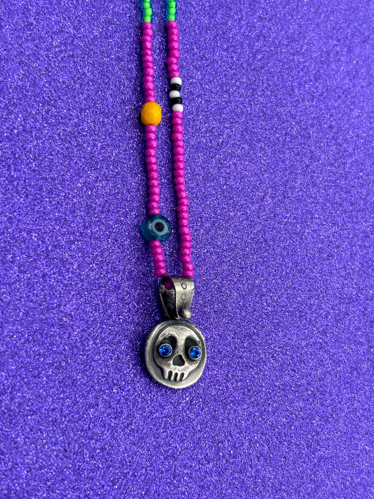 Little Skullie with Blue Spinel Eyes